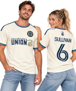 Men and women wearing cream Cavan Sullivan Philadelphia Union third jersey with navy-and-gold chest graphics