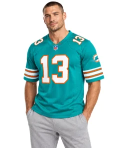 Model wearing a Marino #13 throwback jersey in aqua with white and orange details