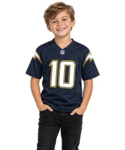 Young model wearing a Kid's Justin Herbert Jersey in navy with white and gold details