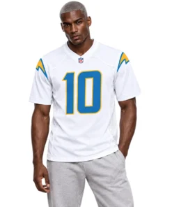 Model wearing a Justin Herbert Number 10 Jersey in white with blue and gold details