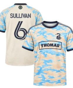 Front and back views of cream and sky-blue Cavan Sullivan soccer jersey with navy number 6