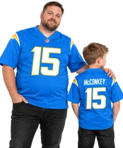 Adult and child wearing matching Ladd McConkey number 15 football jerseys