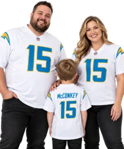 Family wearing matching white Ladd McConkey number 15 football jerseys