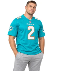 Model wearing a Willis #2 jersey in aqua with white and orange player details