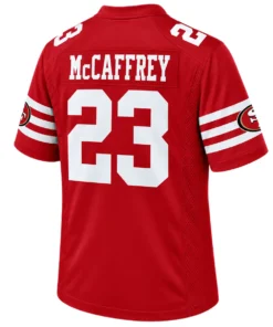 Back view of red Christian McCaffrey 49ers jersey with white McCAFFREY lettering, number 23 and striped sleeves