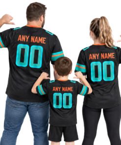 Family wearing matching custom Miami Dolphins jersey styles in black with aqua and orange accents