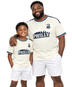 Father and son wearing matching Milan Iloski Philadelphia Union cream jerseys with ILOSKI No. 10