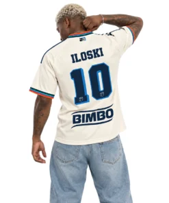 Model wearing Milan Iloski cream Philadelphia Union archive jersey with navy graphics and multicolor trim