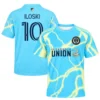 Front and back views of Milan Iloski cyan away soccer jersey with lightning graphics and player No. 10