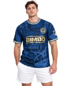 Model wearing Milan Iloski Philadelphia Union navy home jersey with gold graphics and historical illustrations