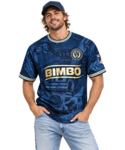 Model wearing navy Philadelphia Union 2026 home soccer jersey with gold trim and historical artwork