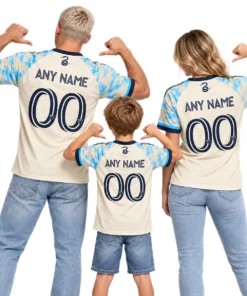 Father, mother and son wearing matching cream and sky-blue Philadelphia Union soccer jerseys